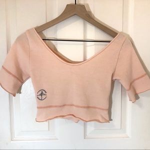 Light pink small warm up wear moi crop tee